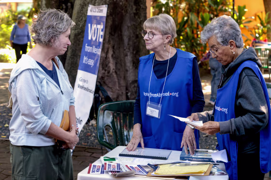 A U.S. citizen living in Mexico receives orientation before casting her electronic ballot.