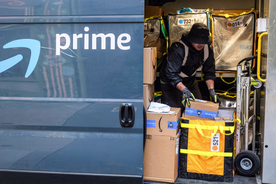 A worker sorts boxes inside an Amazon delivery van