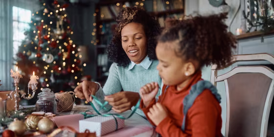 A woman and her daughter preparing for Christmas