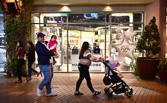 Consumers shop at an outlet mall in Los Angeles on Nov. 8, 2024. 