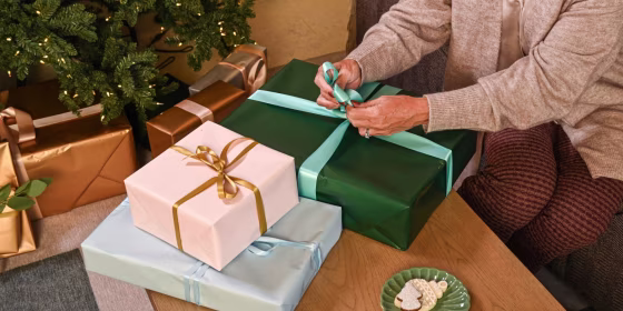 a person wrapping gifts