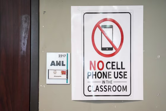 A No Cell Phone Use In The Classroom sign on a wall