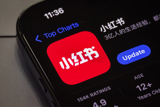 A smartphone screen shows the update page for the RedNote app on the app store