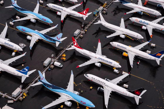 Boeing 737 Max airplanes sit parked outside
