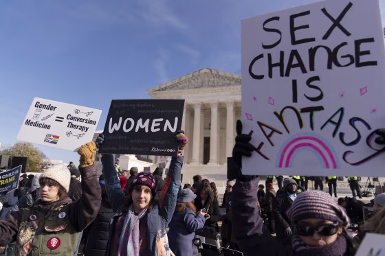Demonstrators against transgenders rights protest during a rally outside of the Supreme Court.