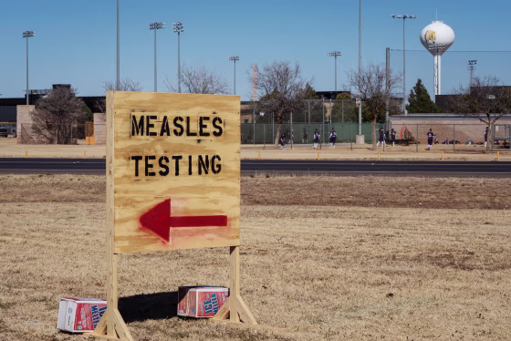 Signs point the way to measles testing in the parking lot of the Seminole Hospital District on Feb. 27, 2025 in Seminole, Texas.