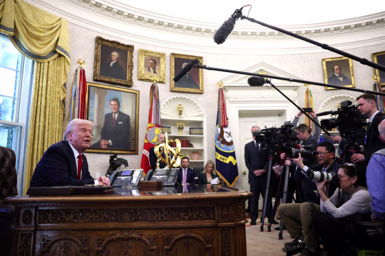 President Donald Trump speaks with reporters