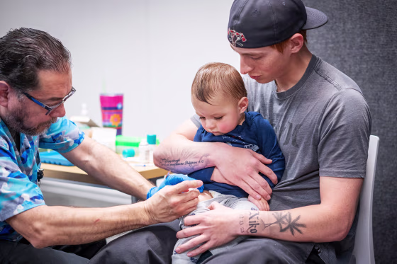 A 14-month-old boy receives a measles vaccine