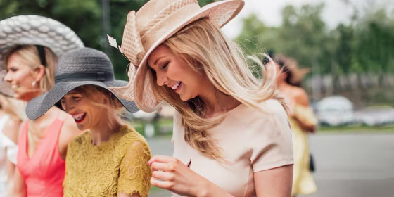 Vibrant dresses and bold hats are the unofficial wardrobe for the Kentucky Derby.