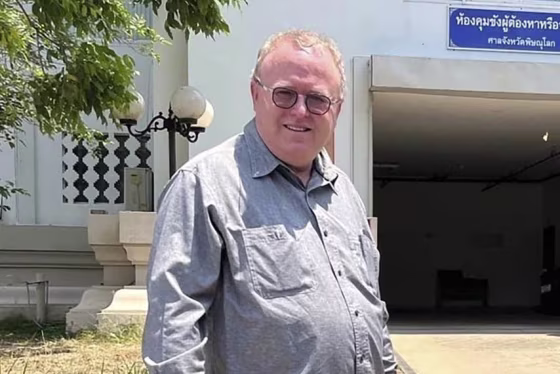 U.S. political science lecturer Paul Chambers outside the police station in Phitsanulok, Thailand, where he was arrested on charges of insulting the monarchy.