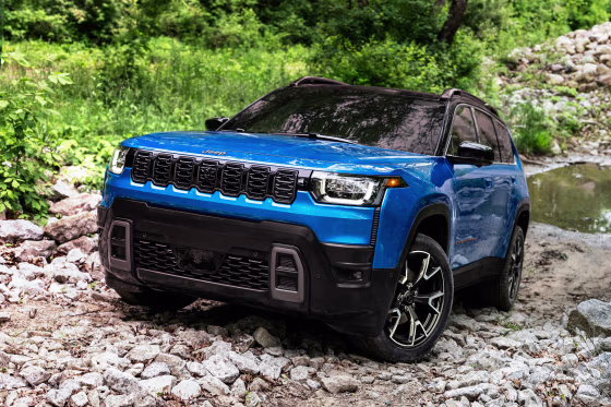 A blue 2025 Jeep Cherokee SUV
