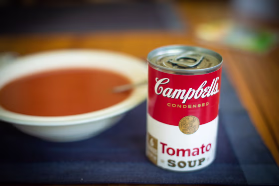 A bowl of soup and a can of Campbell's