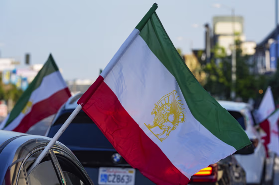 A caravan of vehicles rides while flying the Lion and Sun flag along Westwood Boulevard, in the so-called "Tehrangeles" neighborhood of Los Angeles, Calif., in 2024.