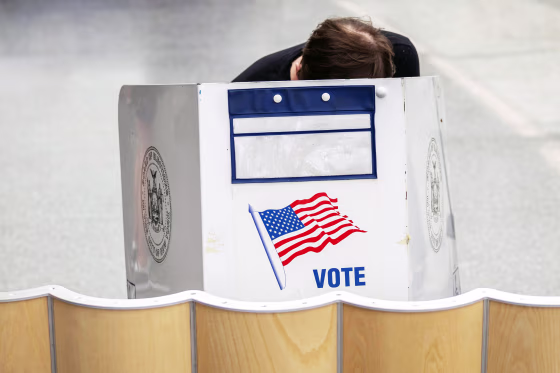 A voter casts a ballot