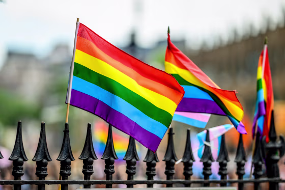 Pride flags on the fence of the Stonewall Monument