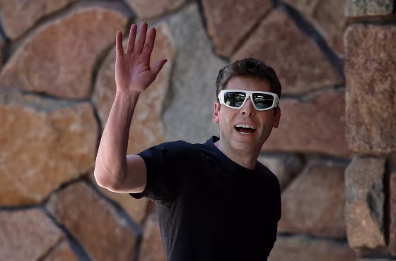 Sam Altman waves as he arrives to Sun Valley.