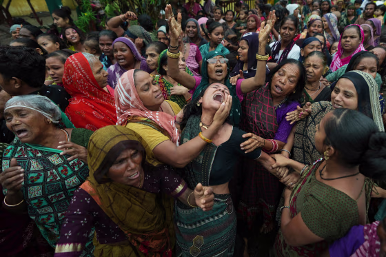 Family members and relatives of Akash Patni grieving during his funeral procession.