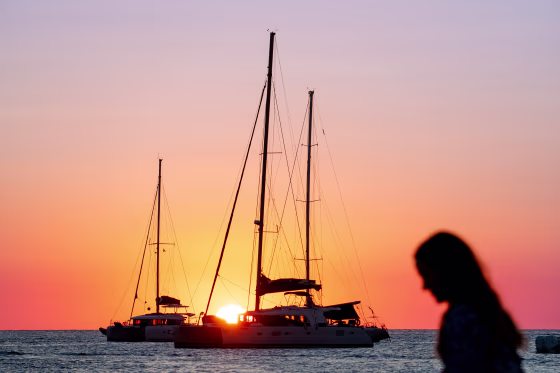 Silhouetted in the sunset with a woman in the foreground