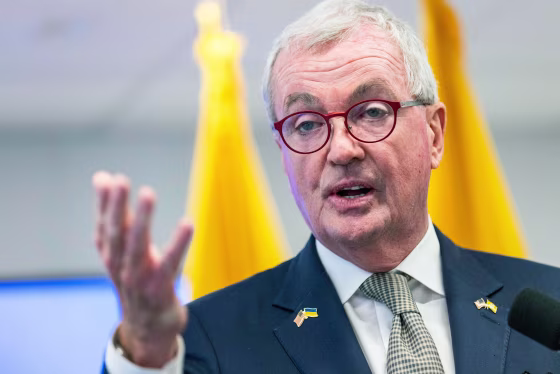 Phil Murphy speaks and gestures with his hand
