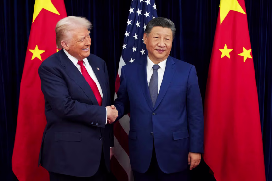 President Donald Trump greets Chinese President Xi Jinping ahead of a bilateral meeting at Gimhae Air Base on Thursday.