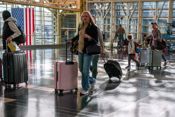 People walk through the Ronald Reagan Washington National Airport.