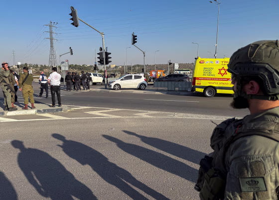 Israeli forces and emergency responders work at the scene of what Israel's ambulance services said was a fatal stabbing attack at the Gush Etzion junction in the Israeli-occupied West Bank
