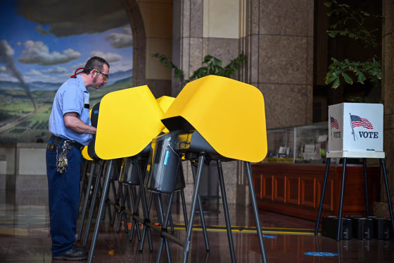 A person casts their vote.