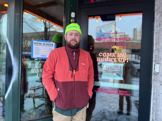 Jeff Rogers stands in front of the doorway to Wrecktangle Pizza
