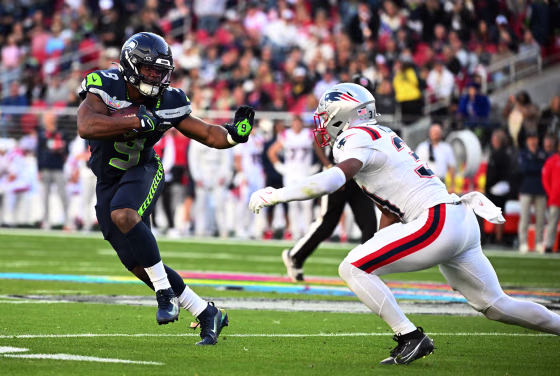 New England Patriots' safety #31 Craig Woodson rushes Seattle Seahawks' running back #09 Kenneth Walker III
