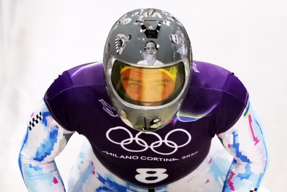 Image: Ukraine's Vladyslav Heraskevych wearing a grey helmet that depicts images of Ukrainians killed in the Russia-Ukraine War.