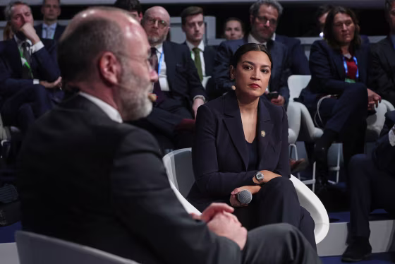 Rep. Alexandria Ocasio-Cortez, D-N.Y., listens as President of the European People's Party Manfred Weber speaks at a panel at the Munich Security Conference