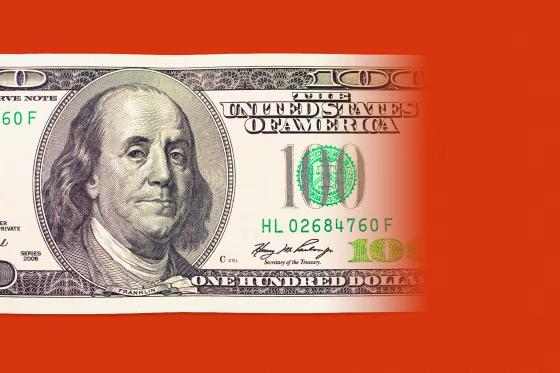 A $100 dollar bill disappearing into red