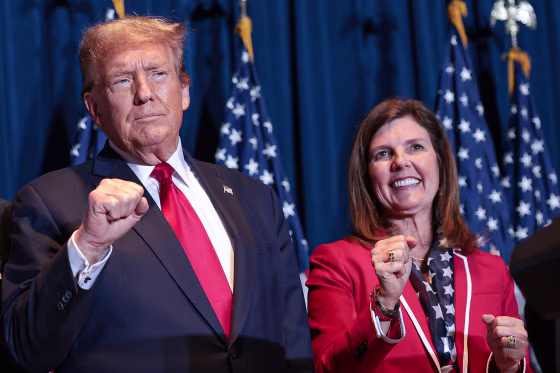 Donald Trump and Lt Governor Pamela Evette stand on stage during an election night watch party at the State Fairgrounds on February 24, 2024 in Columbia, South Carolina.