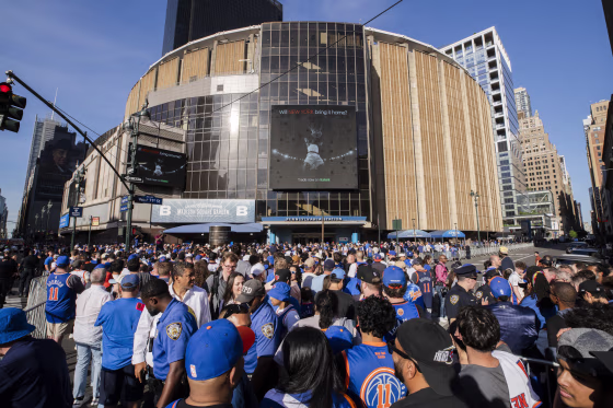 New York Knicks fans wait to enter Madison Square Garden.
