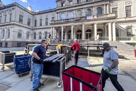 Workers at NYC's City Hall prepare for NY Knicks' victory ceremony