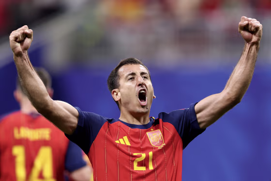 Mikel Oyarzabal pumps both fists in the air in celebration.