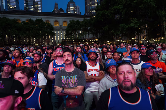 Fans at a watch party in Bryant Park on Tuesday for Game 3 of the NBA Finals between the New York Knicks and the San Antonio Spurs.