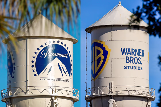 A split composite image showing two water towers, one for Paramount, left, and one for Warner Bros. Studios
