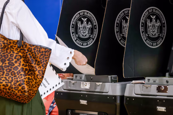 A voter scans their ballot.