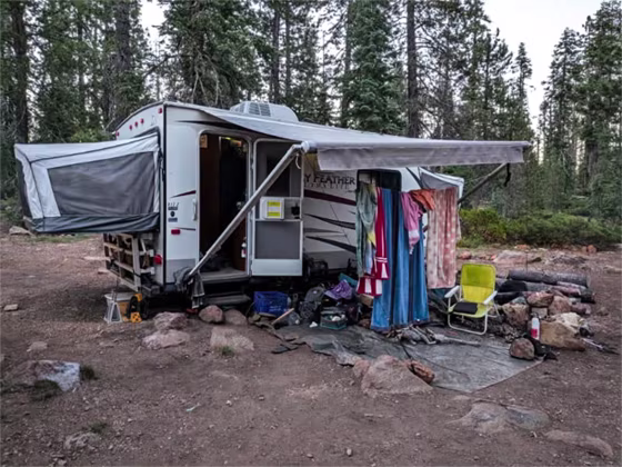 The camping trailer inhabited by Joseph and Phoenix Henrichsen, parked on a road near Gumboot Lake Campground in California.
