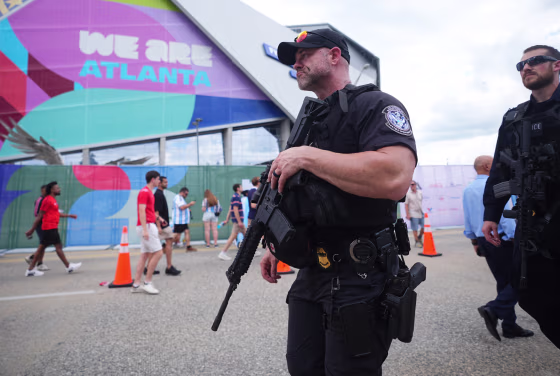 Police officers outside the Atlanta Stadium in Atlanta, Georgia, ahead of the 2026 FIFA World Cup semi-final match between England and Argentina on July 15, 2026. 