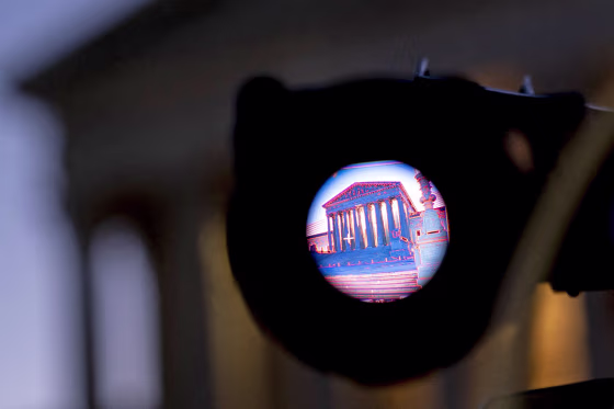 The Supreme Court is seen through the viewfinder of a television camera.