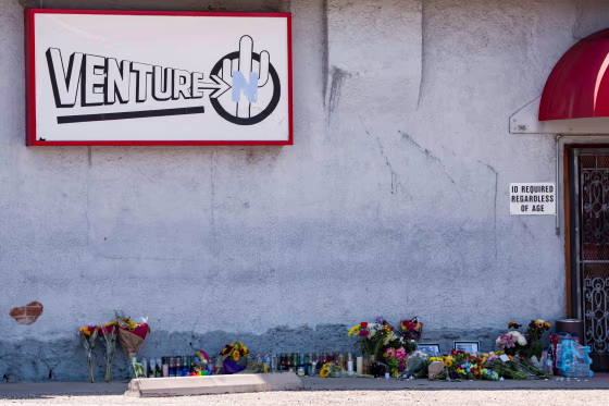 A memorial sits outside Venture-N Bar.