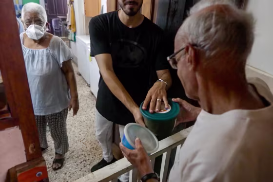 People give food to church goers.