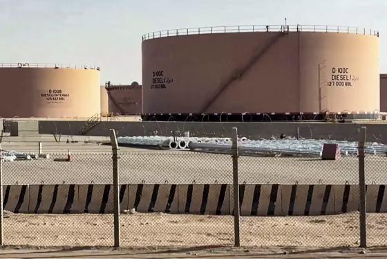 Oil tanks in a desert landscape.