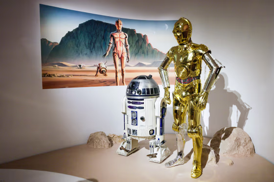 Sculptures of Protocol droid C-3PO, right, and astromech droid R2-D2