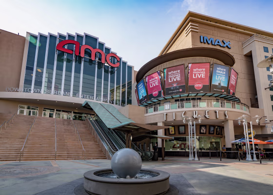 The exterior of a modern AMC IMAX movie theater.