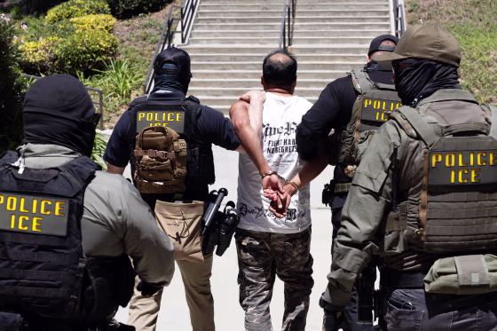 ICE agents walk a detainee out of the Ventura County Government Center in Ventura, CA.