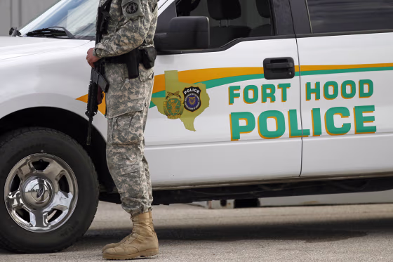 A U.S. Army police officer stands.