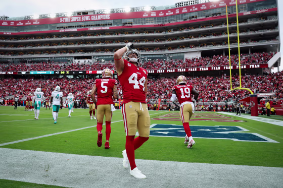 Kyle Juszczyk of the San Francisco 49ers performs his signature "drinking" gesture after scoring a touchdown against the Miami Dolphins on Sept. 20, 2026.